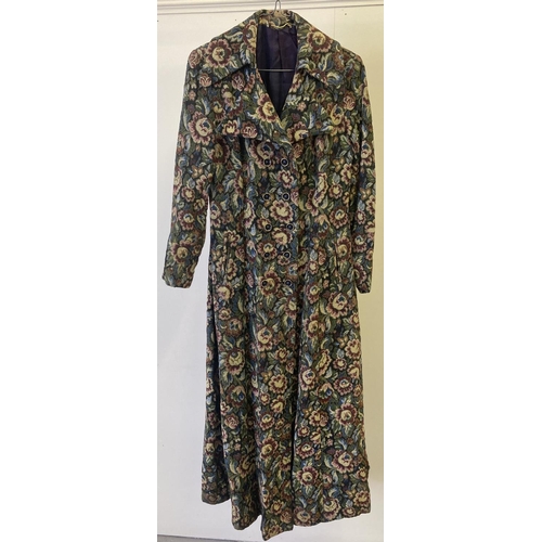 295 - A women's vintage 1970's tapestry style full length coat with winged collar and button fastening.