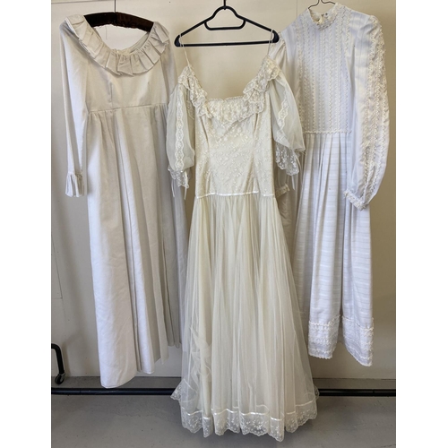 104 - 3 vintage theatre costume dresses in white/cream, to include wedding dress with net overlay.