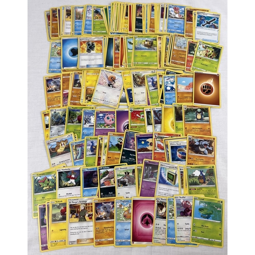 38 - 200 assorted modern pokemon trading cards.
