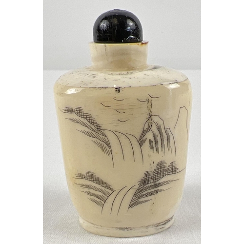 1276 - A small oriental style scent bottle in cream and black depicting an oriental lady in a garden scene.... 