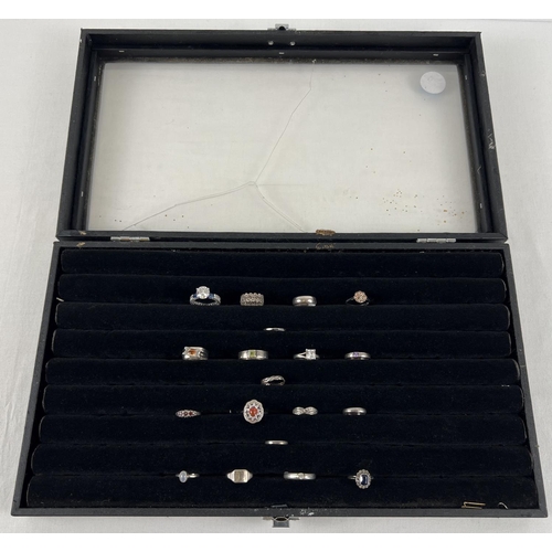 1040 - A large 8 row ring display cabinet with 18 assorted silver & white metal rings. Cabinet perspex is b... 