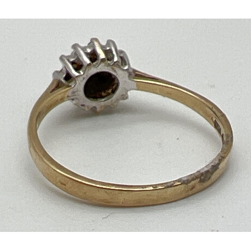 1061 - A 9ct gold diamond cluster ring, fully hallmarked inside band. Ring size L.