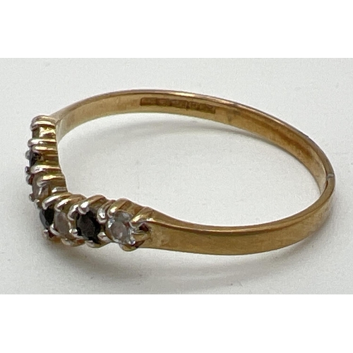 1062 - A 9ct gold, sapphire & cubic zirconia wishbone half eternity ring. Fully hallmarked inside band and ... 