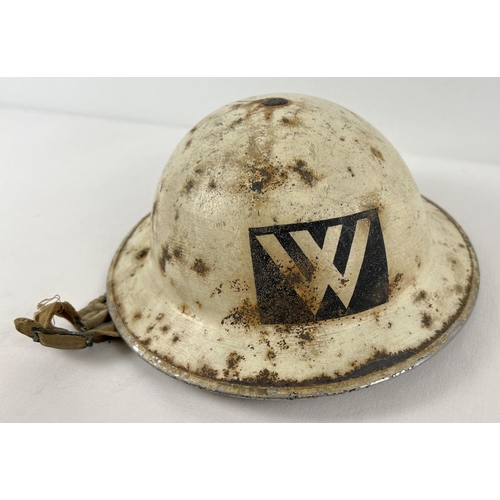 16 - A British WWII Home Front MkII helmet painted white for night time use. With unusual Warden (W) sten... 