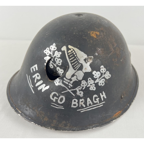 24 - A British MkIV steel helmet shell with painted Eirin Go Bragh (Ireland Forever) slogan. Believed to ... 
