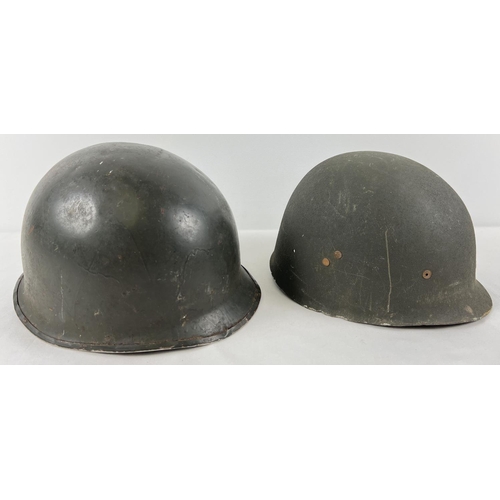 33 - An Argentine M1 steel helmet, front rim stamped 1858/B37. This is a repainted US rear seam M1 steel ... 