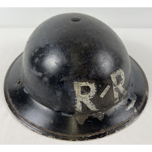 46 - A British WWII Home Front MkII steel helmet painted with white letters R/R. Helmet stamped BMB 1939,... 