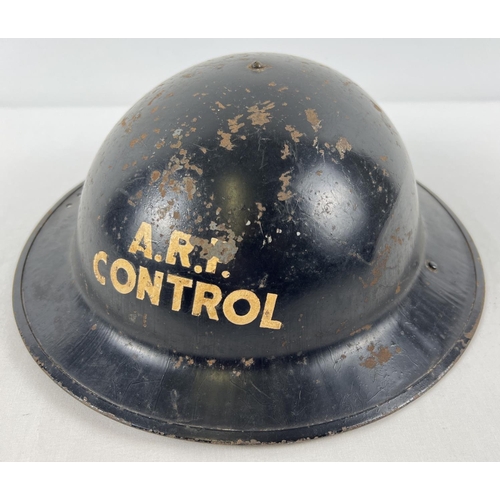 47 - A British Home Front MkII No.2 C type steel helmet labelled ARP CONTROL on front crown. Painted blac... 