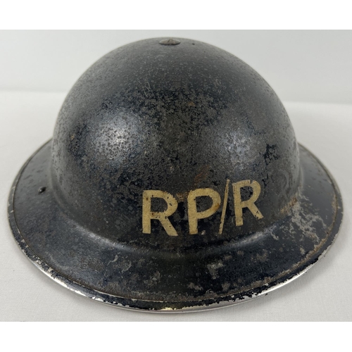 49 - A WWII British MkII Home Front steel helmet labelled RP/R in white front & back. For Repair Party/Ro... 