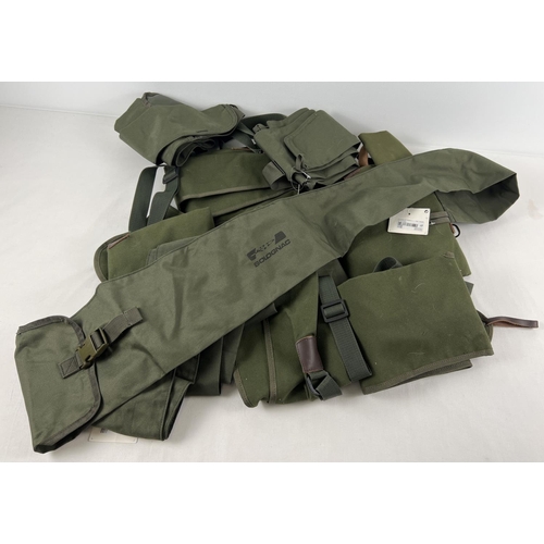 75 - 12 assorted green canvas rifle/shotgun sleeves/slip cases.