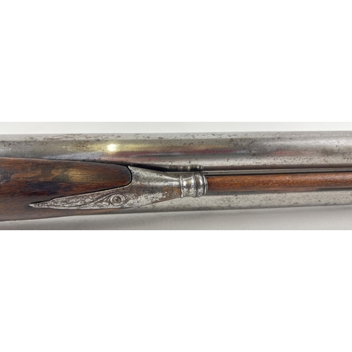 79 - A French Tangelier Borgets 12 bore double barrel percussion left hand shotgun. With engraved stock a... 