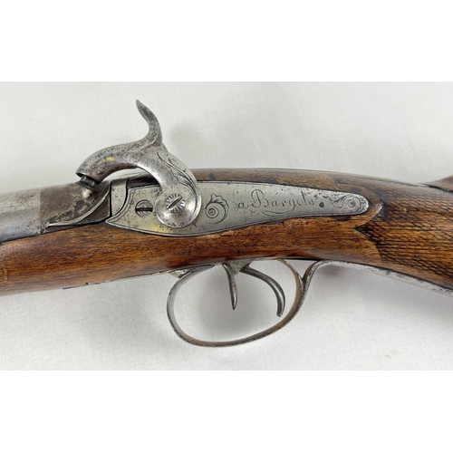 79 - A French Tangelier Borgets 12 bore double barrel percussion left hand shotgun. With engraved stock a... 
