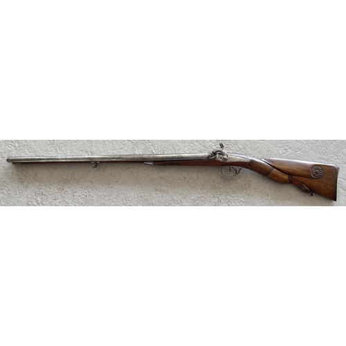 79 - A French Tangelier Borgets 12 bore double barrel percussion left hand shotgun. With engraved stock a... 