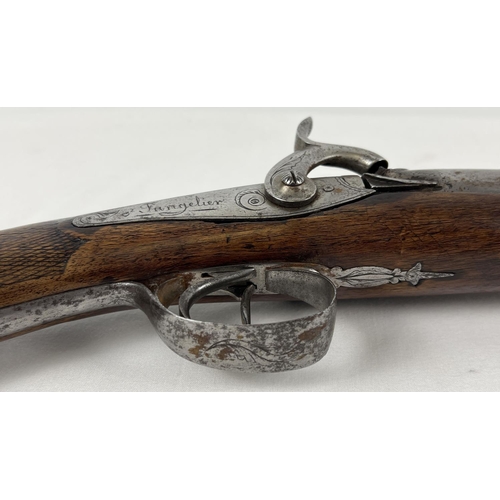 79 - A French Tangelier Borgets 12 bore double barrel percussion left hand shotgun. With engraved stock a... 