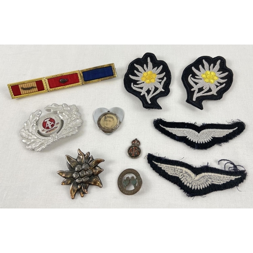 85 - A collection of mixed modern and vintage military cloth and cap badges. To include: AFS home front f... 