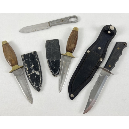 89 - A collection of 4 military and survival knives. To include U.S. Military mess knife and a survival k... 