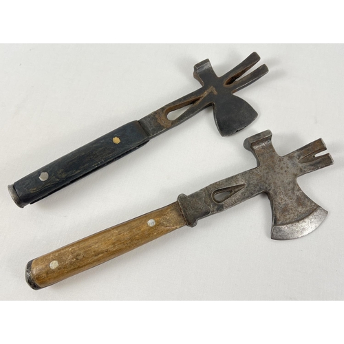 96 - 2 replica cast iron and wooden handled multitool hatchets. Largest approx 34cm long.