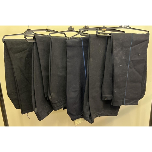 139 - 6 pairs of dark blue trousers with a blue piped leg stripe.