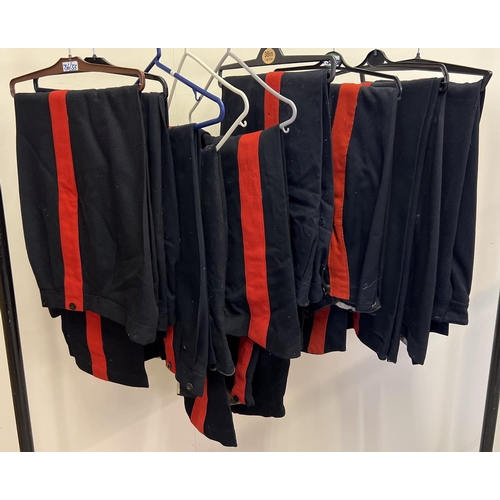 141 - 9 pairs of military style trousers, dark blue with red leg stripe.