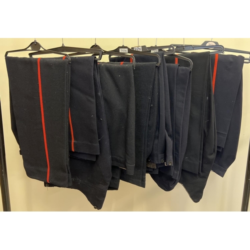 152 - 8 pairs of military style dark blue trousers with red leg stripe detail.