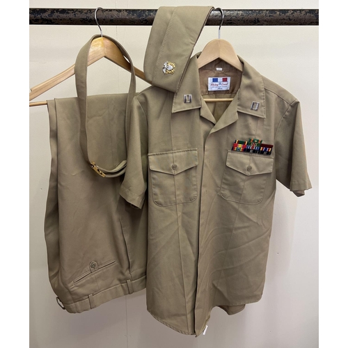 154 - A modern reproduction 2 piece US Army Khaki uniform with belt, and matching side cap. With metal pin... 