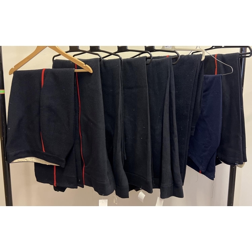 164 - 8 pairs of military style trousers with red leg stripe detail.