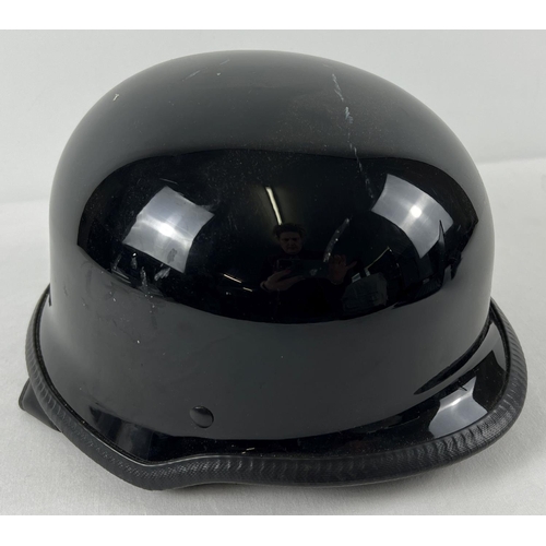 169 - A modern HCI Dot black motorcycle helmet with under chin strap and padded liner.