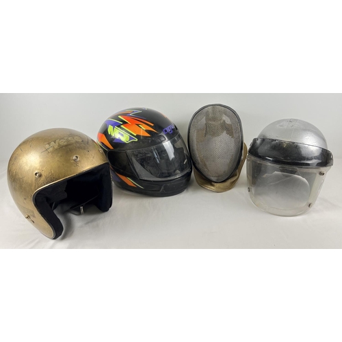 173 - 4 assorted motorcycle helmets together with a vintage fencing face guard.