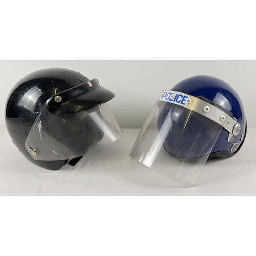 174 - 2 vintage riot helmets with visors, to include Police helmet.