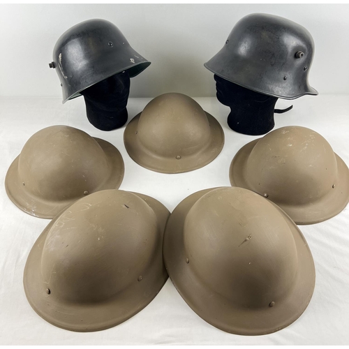 175 - A box of assorted modern plastic WWII style re-enactment helmets. To include British and German.
