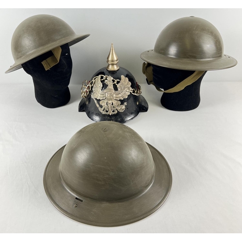 176 - 4 modern hard plastic re-enactment helmets. 3 British WWII style and an Imperial Pickelhaub style he... 