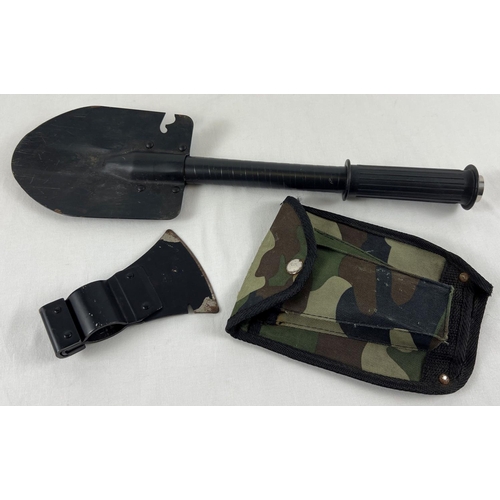 177 - A modern military style shovel tool with axe head attachment and camo design case.