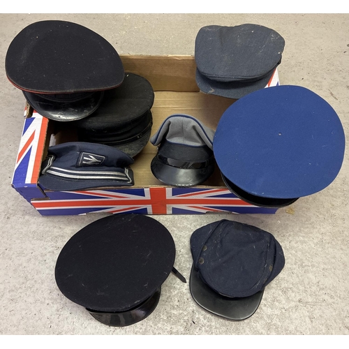 180 - A box of assorted vintage military style peaked caps. To include British Rail.