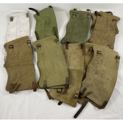 191 - A collection of assorted WWII and later canvas ankle/boot gaiters with leather straps. Some stamped ... 