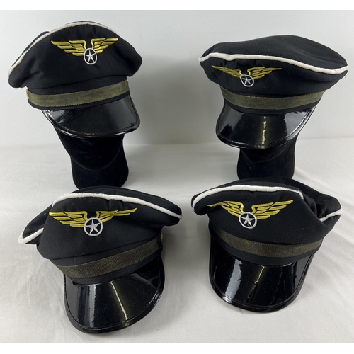 193 - 4 modern re-enactment peaked caps with embroidered winged star design.