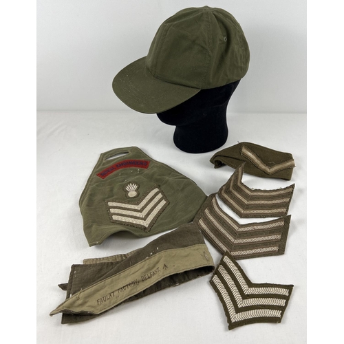 199 - A small collection of assorted army cloth accessories to include a Hot Weather canvas peaked cap, ar... 