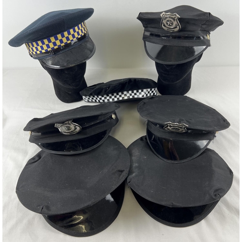 205 - A collection of assorted modern re-enactment/theatrical Police hats.