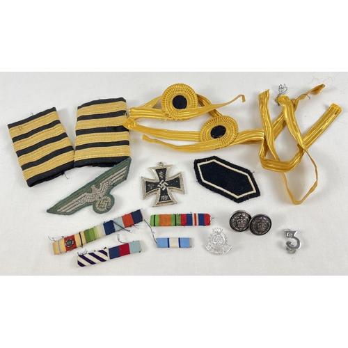 235 - A small collection of assorted military and naval badges, buttons and bullion stripes. To include Ge... 