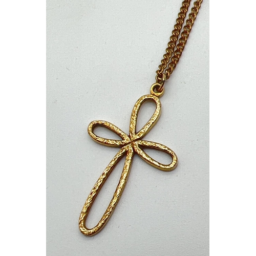 1011 - A large 9ct gold looped cross pendant and chain. A 4cm drop pendant, fully hallmarked and with maker... 