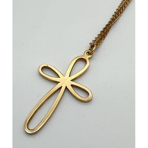 1011 - A large 9ct gold looped cross pendant and chain. A 4cm drop pendant, fully hallmarked and with maker... 