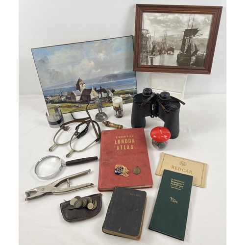 1235 - A box of assorted misc items to include binoculars, coins, magnifying glass, stirrups with leather s... 