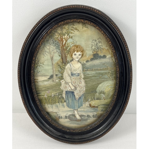 1240 - An antique embroidery on silk oval shaped picture featuring a young girl in the river. In period bla... 