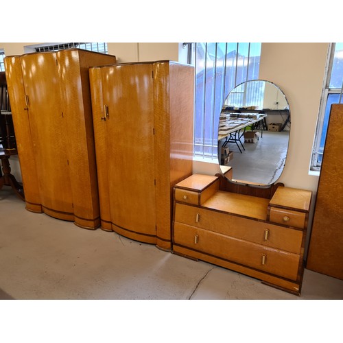 1299 - An Art Deco birds eye maple veneer bow fronted 4 piece bedroom suite. With inlaid banded detail and ... 