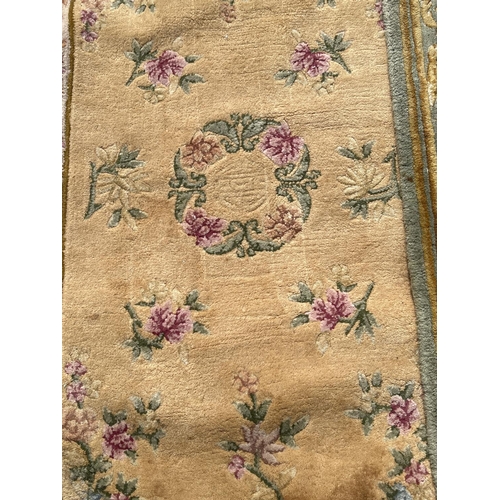 1301 - 5 Chinese style rugs with floral detail, in varying colours and sizes. To include pink ground runner... 