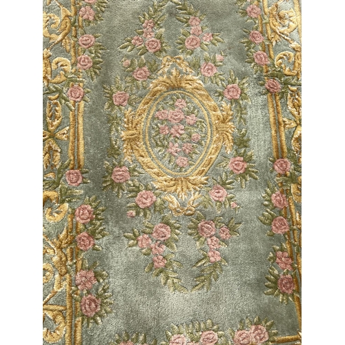 1301 - 5 Chinese style rugs with floral detail, in varying colours and sizes. To include pink ground runner... 