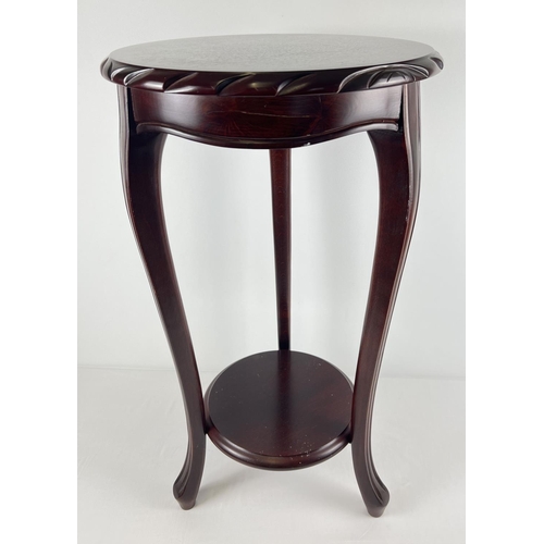 1314 - A modern mahogany coloured circular jardiniere/lamp stand with shaped legs and carved edging. Approx... 