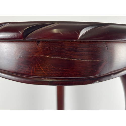 1314 - A modern mahogany coloured circular jardiniere/lamp stand with shaped legs and carved edging. Approx... 