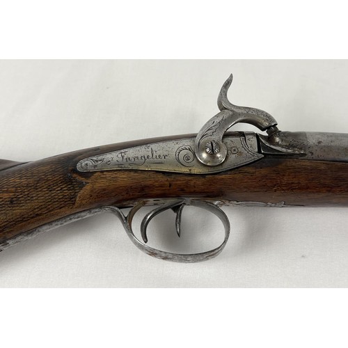 79 - A French Tangelier Borgets 12 bore double barrel percussion left hand shotgun. With engraved stock a... 