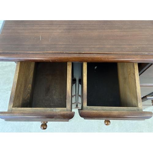 1316 - A vintage dark wood 16 drawer chest. With square shaped drawers and wooden knob handles. Approx. 85c... 