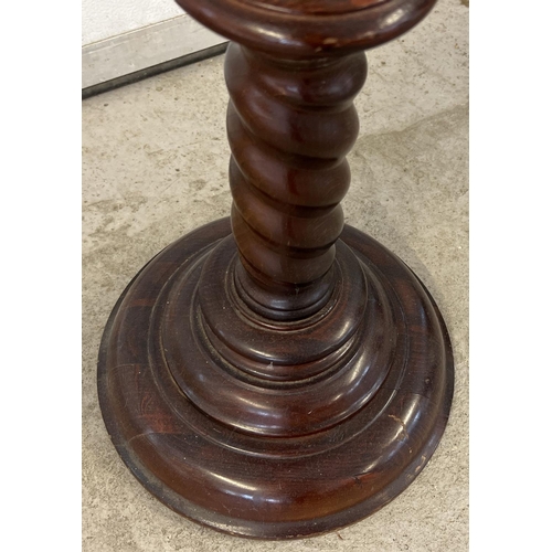 1318 - A modern mahogany coloured torchere with twist stem design. Approx. 98cm tall, diameter of circular ... 